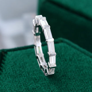 Exquisite 0.11ct baguette moissanite wedding band shown on a finger