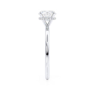 Radiant 1.0ct round hidden halo moissanite ring shown on a finger