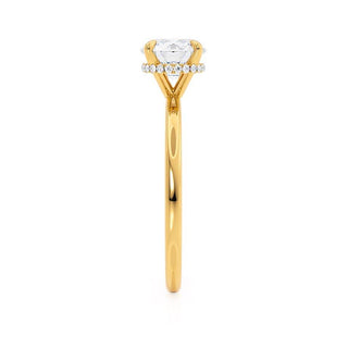 Refined 1.0ct round hidden halo moissanite ring shown on a finger