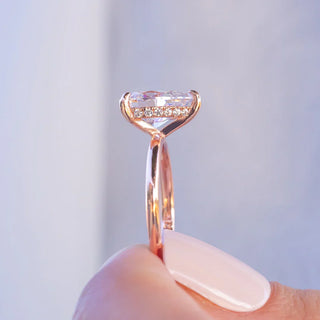 Bold 1.33ct pear hidden halo moissanite ring shown on a finger