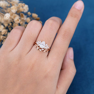 Chic 1.0ct pear cluster moissanite ring side profile view