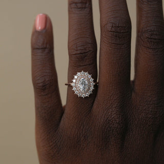 Stunning 0.75ct oval halo moissanite ring angled view showing its sparkle