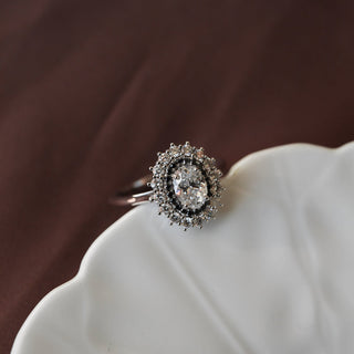 Classic 0.75ct oval halo moissanite ring shown on a finger