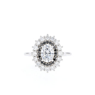 Classic 0.75ct oval halo moissanite ring tilted view catching the light