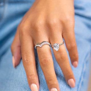 Brilliant 1.33ct pear hidden halo moissanite ring front view