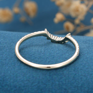 Modern 1.30ct round moissanite wedding band shown on a finger