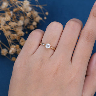 Lustrous 0.41ct round solitaire moissanite ring angled view showing its sparkle