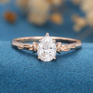 0.69 CT Pear Brilliant Sparkling Moissanite Engagement Ring front view
