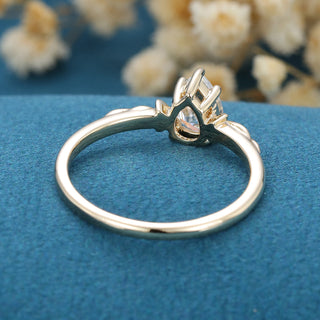 0.69 CT Pear Brilliant Cut Halo Moissanite Engagement Ring on hand