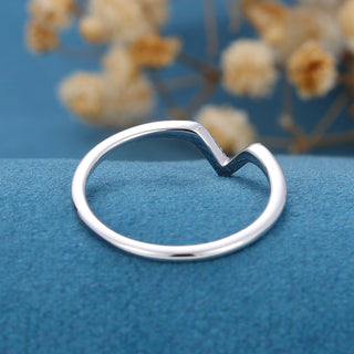 Vintage 1.30ct round moissanite wedding band shown on a finger