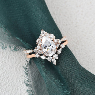 Dazzling 1.50ct pear cluster moissanite ring shown on a finger