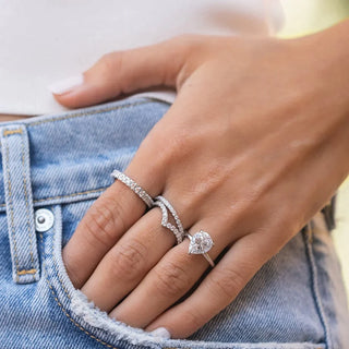 Brilliant 1.33ct pear hidden halo moissanite ring angled view showing its sparkle