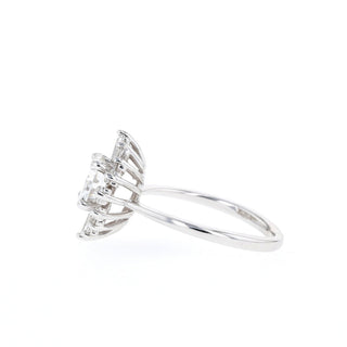 Brilliant 1.05ct round cluster moissanite ring tilted view catching the light