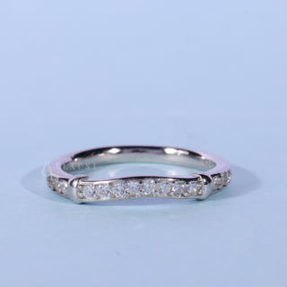 Lustrous round moissanite wedding band front view