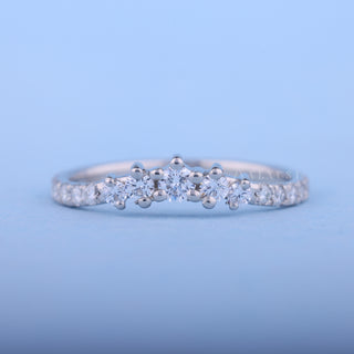 Shimmering round moissanite wedding band front view