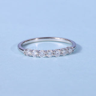 Elegant round half eternity moissanite wedding band front view