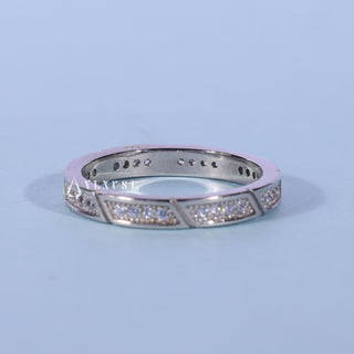 Stunning round pave moissanite wedding band angled view showing its sparkle