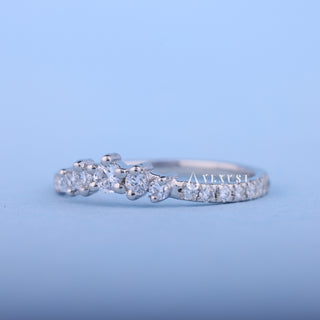 Shimmering round moissanite wedding band angled view showing its sparkle