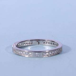 Sparkling round pave moissanite wedding band angled view showing its sparkle