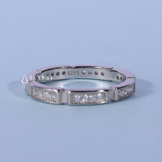 Luminous round pave moissanite wedding band angled view showing its sparkle