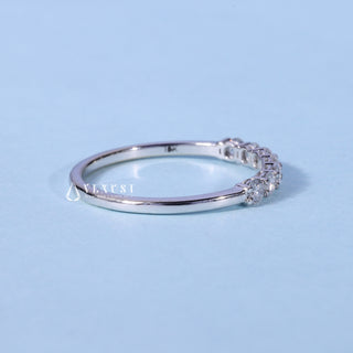 Elegant round half eternity moissanite wedding band angled view showing its sparkle