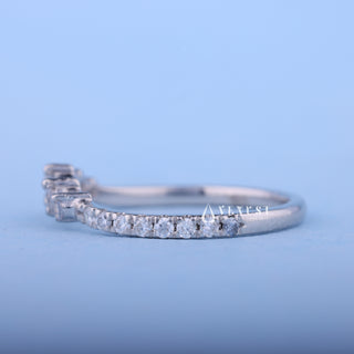 Shimmering round moissanite wedding band side profile view