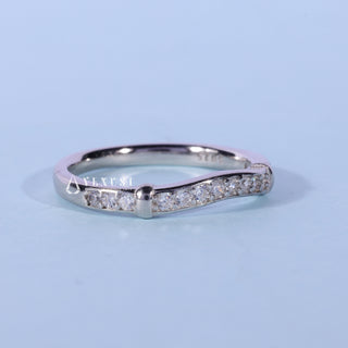Lustrous round moissanite wedding band side profile view