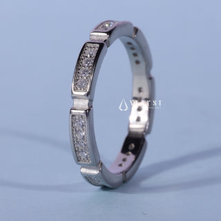 Luminous round pave moissanite wedding band close up of the setting