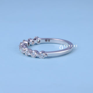 Exquisite round pave moissanite wedding band close up of the setting