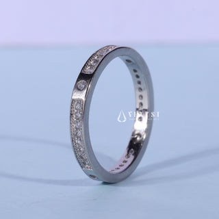 Sparkling round pave moissanite wedding band close up of the setting