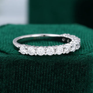Lustrous 0.78ct round half eternity moissanite wedding band side profile view