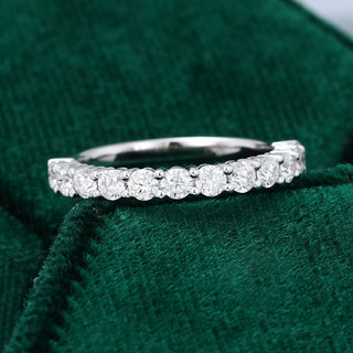 Lustrous 0.78ct round half eternity moissanite wedding band close up of the setting