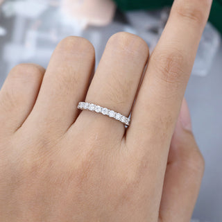 Lustrous 0.78ct round half eternity moissanite wedding band front view