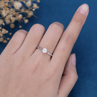Shimmering 0.41ct round solitaire moissanite ring angled view showing its sparkle