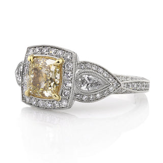 Yellow cushion three stone moissanite engagement ring side view