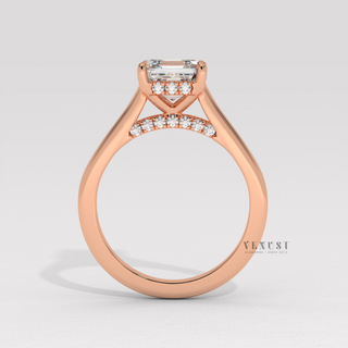 Front view of a asscher cut moissanite engagement ring with a hidden halo and cathedral setting under soft light