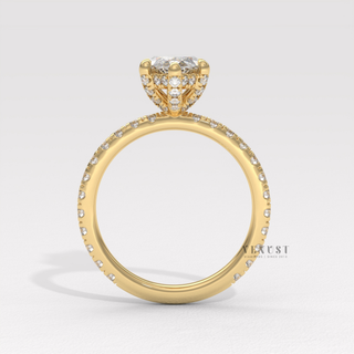 Marquise cut moissanite engagement ring with a hidden halo and pave band photographed on a white background