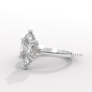 Full view of a marquise cut moissanite engagement ring in a hidden halo solitaire setting with band detail