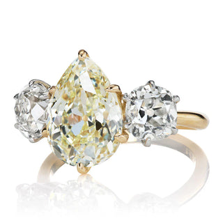 yellow moissanite engagement ring three stone detail