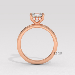 Tilted view of a asscher cut moissanite engagement ring in a hidden halo solitaire setting showing its sparkle