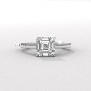 Side profile of a asscher cut moissanite engagement ring with a hidden halo and cathedral setting