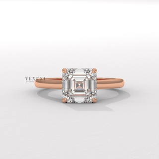 Angled view of a asscher cut moissanite engagement ring with a hidden halo and cathedral setting catching the light