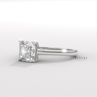 Three-quarter angle of a asscher cut moissanite engagement ring with a hidden halo and cathedral setting