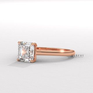 Tilted view of a asscher cut moissanite engagement ring with a hidden halo and cathedral setting showing its sparkle