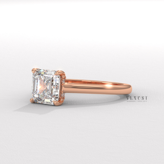 Close-up of a asscher cut moissanite engagement ring with a hidden halo and cathedral setting
