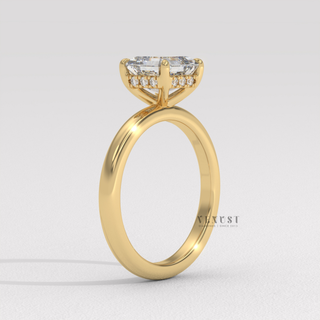 Asscher cut moissanite engagement ring in a hidden halo solitaire setting photographed on a white background
