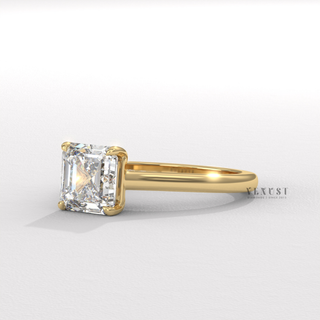 Overhead close-up of a asscher cut moissanite engagement ring with a hidden halo and cathedral setting
