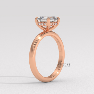 Angled view of a asscher cut moissanite engagement ring in a hidden halo solitaire setting catching the light