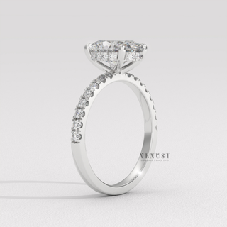 Front view of a oval cut moissanite engagement ring with a hidden halo and half pave band from the left