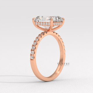 Radiant cut moissanite engagement ring with a hidden halo and pave band photographed on a white background